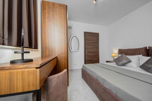 Katil atau katil-katil dalam bilik di Central Apartments