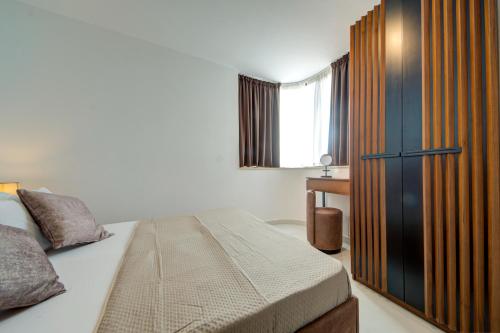 Katil atau katil-katil dalam bilik di Central Apartments