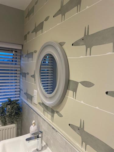 a bathroom with fighter planes painted on the wall at Lovely flat set in parish boundary of Instow in Instow