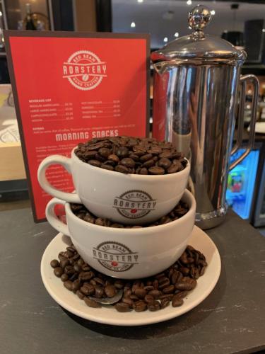 two coffee cups stacked on top of each other on a table at Clayton Hotel Belfast City in Belfast