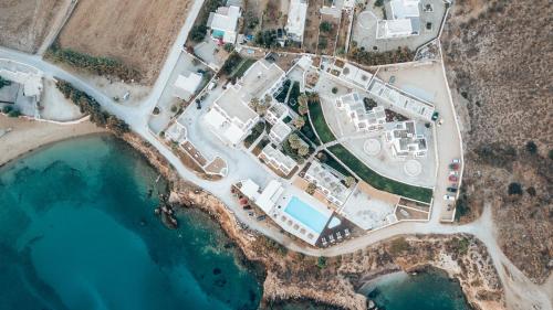 an aerial view of a building next to a body of water at Paros Bay in Parasporos