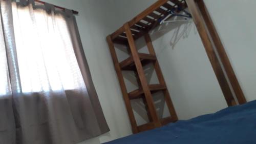 سرير أو أسرّة في غرفة في Rincón Joven II