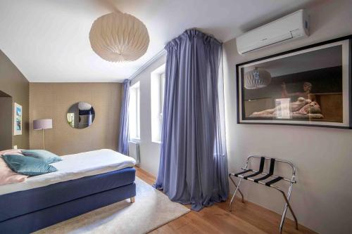 a bedroom with a bed and a window at MyHouseSpain - Modern penthouse close to Gran Via - Big Terrace in Madrid