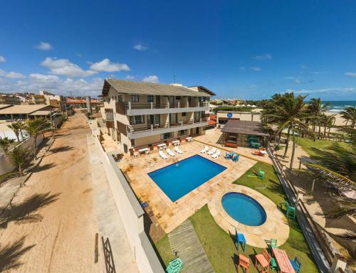 an aerial view of a resort with a swimming pool at Milos Beach Hotel in Aquiraz