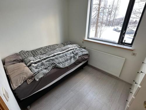 En eller flere senge i et værelse på Akureyri apartment