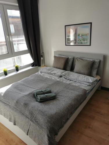 Postel nebo postele na pokoji v ubytování Apartamenty Piaskowe
