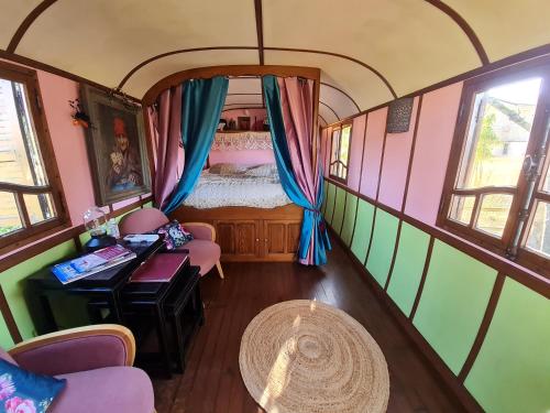 an overhead view of a bedroom in a train car at Roulotte d'Aquitaine in Saint-Sulpice-de-Faleyrens