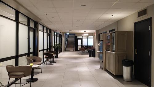 a hallway with chairs and tables in a building at Quality Hotel Augustin in Trondheim