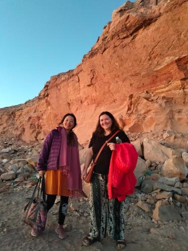 two women standing in front of a cliff at Safari Abu Simbel in Abu Simbel