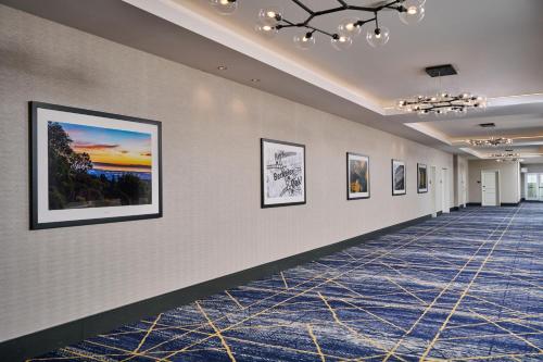 a hallway with paintings on the walls of a building at Residence Inn By Marriott Berkeley in Berkeley