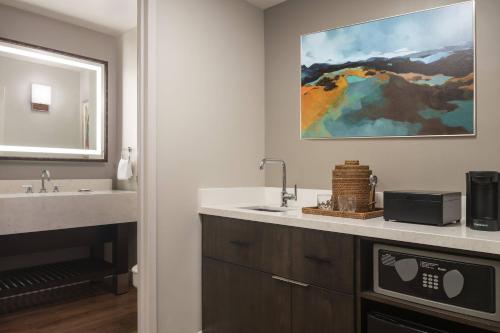 a bathroom with a sink and a microwave at Waikoloa Beach Marriott Resort & Spa in Waikoloa