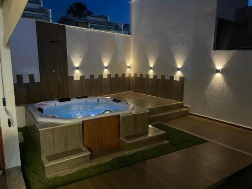 a jacuzzi tub in a building with lights at Casa em Barreirinhas - Prime - Lençois Maranhenses - Temporada in Barreirinhas