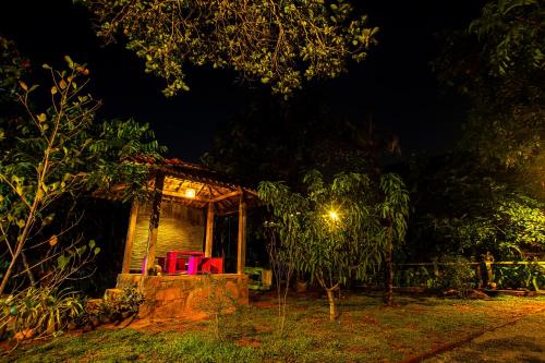 a night time picture of a house with a light at villa ovita in Talpe