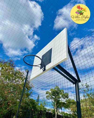 a basketball hoop in front of a building at Apartasol Villa Sofia, Reserva de la Colina, La Tebaida, Quindio in La Tebaida
