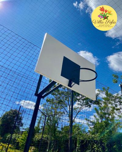 a basketball hoop in front of a fence at Apartasol Villa Sofia, Reserva de la Colina, La Tebaida, Quindio in La Tebaida