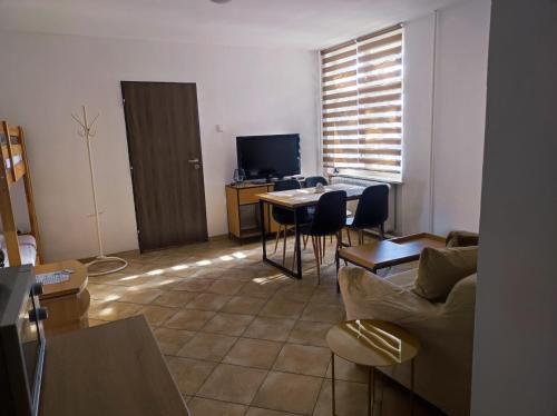 a living room with a couch and a table at Ubytovani-prostejov in Prostějov