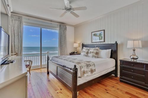 En eller flere senge i et værelse på Beach Front 3 Bedroom D