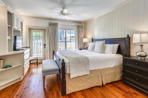 a bedroom with a large bed and a window at Townhouse 3 Bedroom B in Holmes Beach
