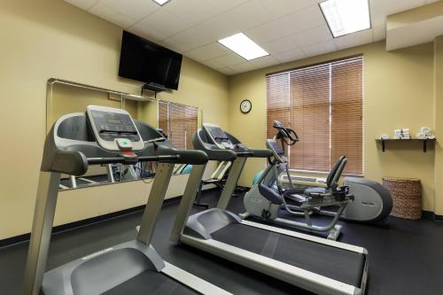 a gym with two tread machines in a room at MainStay Suites Fitchburg - Madison in Madison