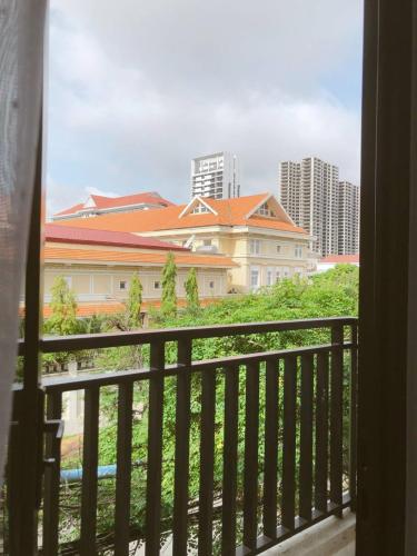 a view of a city from a balcony at Ptas Tauch Residence in Phnom Penh