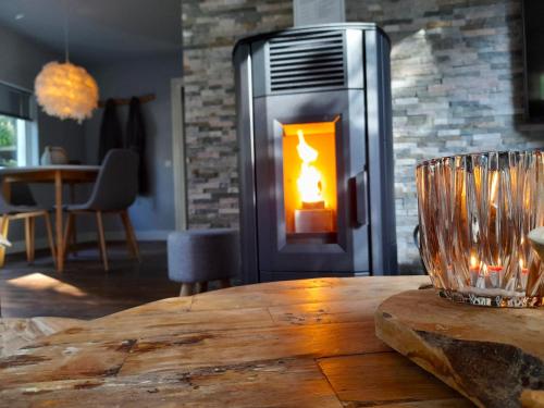 a table with a fire inside of a refrigerator at Secret Wellness Boszicht in Holten