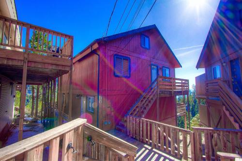 a red building with a wooden stairway in front of it at Bigler Bonus condo in Stateline