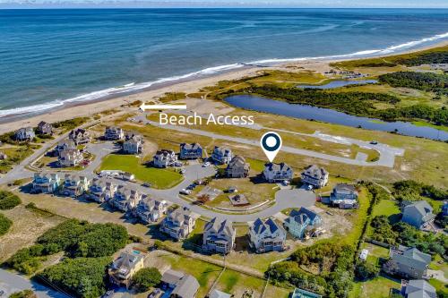 an aerial view of a beach area next to the ocean at Spot at the Cape in Buxton