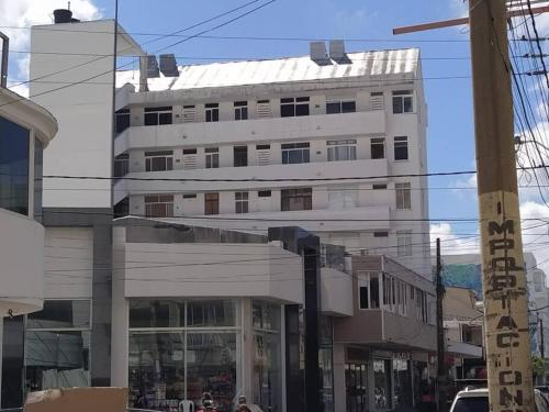 a large white building on a city street at Edificio Santa Catalina in San Andrés