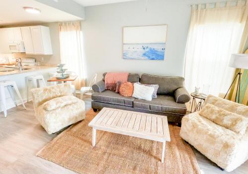 a living room with a couch and two chairs at Duplex allows for one or both sides to be rented! Suitable for small or large families! in Gulf Shores