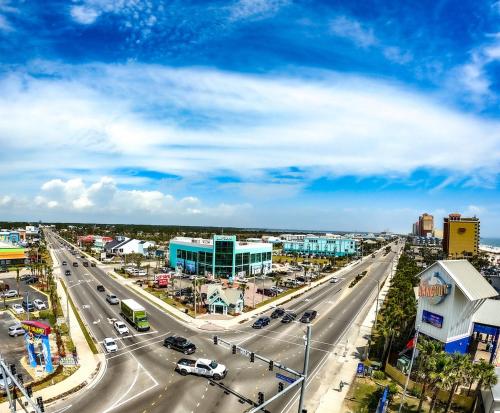 a city with a highway with cars on it at Budget Friendly Bungalow within Walking Distance to the Beach! in Gulf Shores