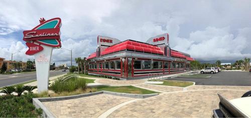 a fast food restaurant with a sign in front of it at Budget Friendly Bungalow within Walking Distance to the Beach! in Gulf Shores