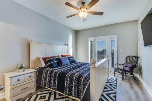 a bedroom with a bed and a ceiling fan at Modern, 3 BR Private House within Walking Distance to the Beach! in Gulf Shores