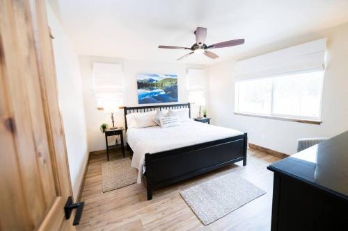 a bedroom with a bed and a ceiling fan at Close to RMNP, Estes,& Amenities in Estes Park