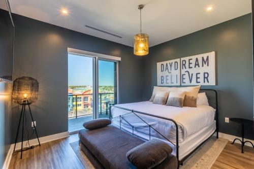 a bedroom with a bed and a large window at Enjoy the perfect Getaway at Gulf Place 4 BR Condo next to the Hangout! GP 304 in Gulf Shores