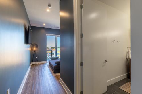 a living room with a couch and a sliding glass door at Enjoy the perfect Getaway at Gulf Place 4 BR Condo next to the Hangout! GP 304 in Gulf Shores