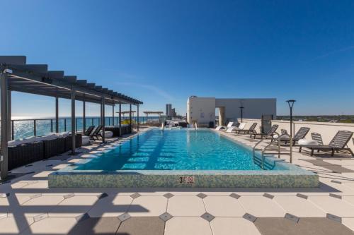 a swimming pool on the roof of a building at Spacious 4 BR Beachfront, Luxury Condo Next to the Hangout- GP 301 in Gulf Shores