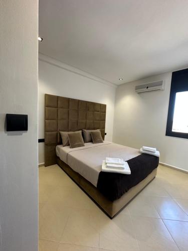 Katil atau katil-katil dalam bilik di Luxury appartement Fes