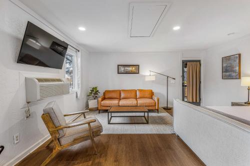 a living room with a couch and a chair at The Wells Cashiers in Cashiers