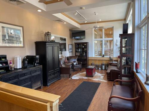 a living room filled with furniture and a living room with a couch at Ranch Inn Jackson Hole in Jackson