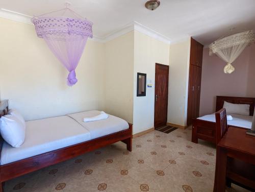 Kasenene Legacy Hotelにあるベッド