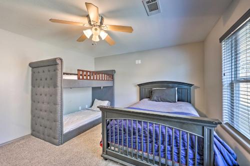a bedroom with a bunk bed and a ceiling fan at Le Bleu, Bright Hodgen Home with Fire Pit and Views! in Hodgen