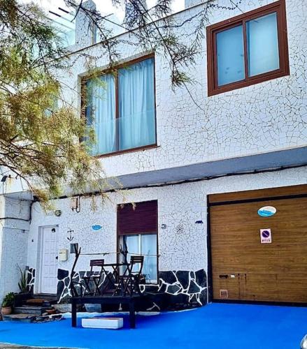 a building with bikes parked in front of a garage at Atico de la Pardela in La Laguna