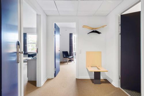 an office with a hallway with a desk and a table at Best Western Hotel Hillerød in Hillerød