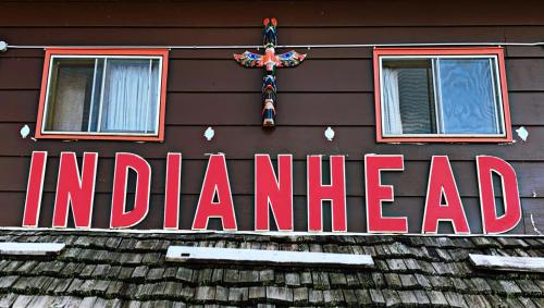 a red sign on the side of a building at Indianhead Ironwood Hotel in Ironwood