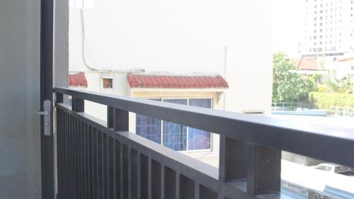 a balcony with a view of a building at Ptas Tauch Residence in Phnom Penh