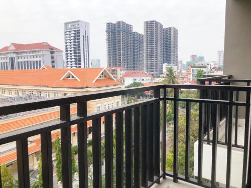 a balcony with a view of the city at Ptas Tauch Residence in Phnom Penh