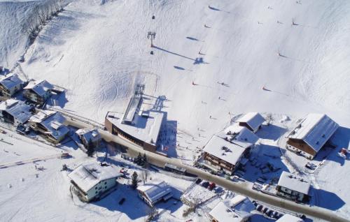 an aerial view of a ski resort in the snow at Cozy Apartment In Grossarl With House A Mountain View in Grossarl