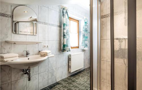 a bathroom with a sink and a mirror at Stunning Apartment In Grossarl With 2 Bedrooms And Wifi in Grossarl