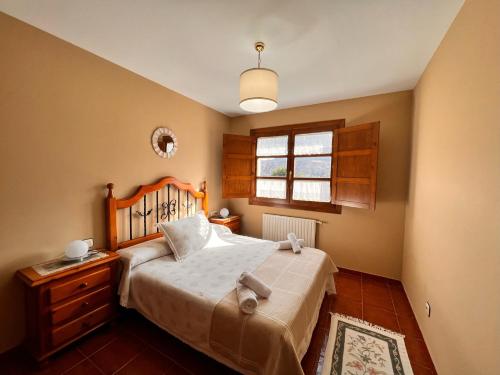 Кровать или кровати в номере Los Robles Andrin