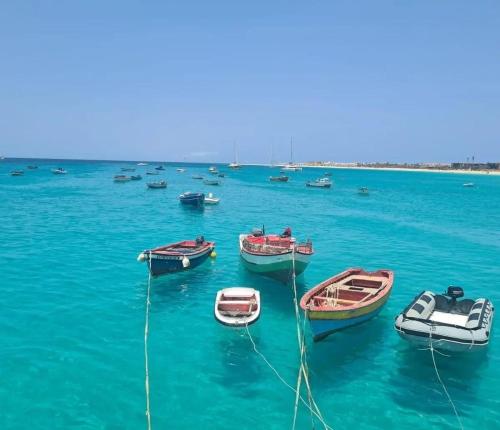 a group of boats in a large body of water at Sal Apartments Djadsal Moradias in Santa Maria